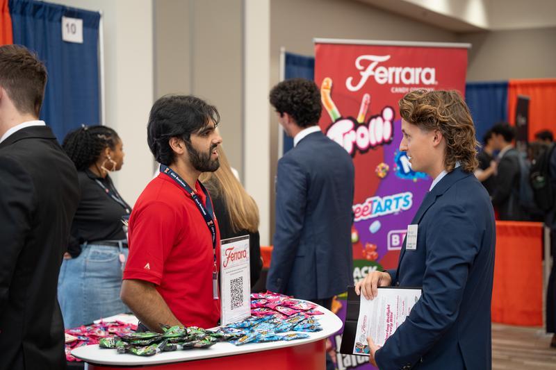 Employer and student engaging at an career fair