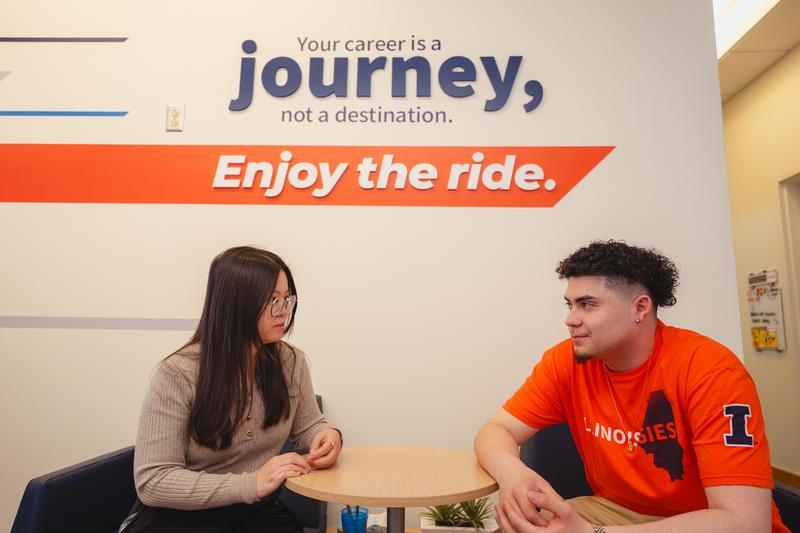 students in the Career Services office lobby talking